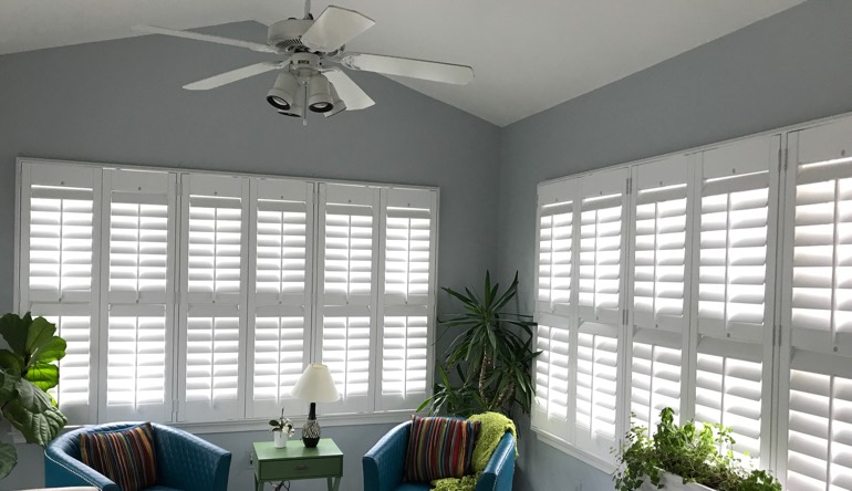 New York City living room with fan and shutters